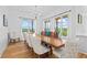 Elegant dining room with hardwood floors, chandelier, and natural light at 5315 Hendrix Rd, Cumming, GA 30040
