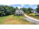 Beautiful two-story farmhouse featuring a welcoming front porch and a long driveway at 5315 Hendrix Rd, Cumming, GA 30040