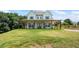 Charming two-story farmhouse with a large front porch and a well-maintained lawn at 5315 Hendrix Rd, Cumming, GA 30040