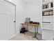 A functional home office features a built-in bookshelf, providing ample space for work and storage at 5315 Hendrix Rd, Cumming, GA 30040