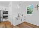 Charming wet bar area with sleek cabinetry, stainless steel appliances, and hardwood floors at 5315 Hendrix Rd, Cumming, GA 30040