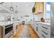 Bright and open kitchen featuring a long island with stainless steel appliances and pendant lighting at 5315 Hendrix Rd, Cumming, GA 30040