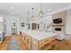 Open kitchen featuring a large central island, stainless appliances, and hardwood floors at 5315 Hendrix Rd, Cumming, GA 30040