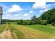 A view of the verdant rolling hills on the lot at 5315 Hendrix Rd, Cumming, GA 30040
