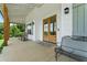 Covered front porch featuring rocking chairs and a welcoming entryway at 5315 Hendrix Rd, Cumming, GA 30040
