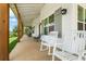 Inviting front porch with rocking chairs and views of the surrounding landscape at 5315 Hendrix Rd, Cumming, GA 30040