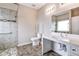 Accessible bathroom features a step-free shower, grab bars, and comfort-height toilet for ease of use at 6470 Saint Mark Way, Fairburn, GA 30213