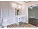 Accessible bathroom design features a roll-under sink, grab bars, and open space for mobility at 6470 Saint Mark Way, Fairburn, GA 30213