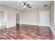 A bedroom with wood floors and a ceiling fan at 6470 Saint Mark Way, Fairburn, GA 30213
