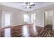 A large bedroom featuring wood floors and natural light at 6470 Saint Mark Way, Fairburn, GA 30213