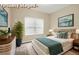 Staged bedroom featuring a comfortable bed, nightstands, and modern decor at 6470 Saint Mark Way, Fairburn, GA 30213