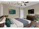 Staged bedroom featuring a comfortable bed, TV and modern decor at 6470 Saint Mark Way, Fairburn, GA 30213