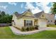 Charming single-story home with well-maintained lawn, lush landscaping, and attached two car garage at 6470 Saint Mark Way, Fairburn, GA 30213