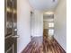 Welcoming hallway with hardwood floors leading to the living areas, offering a glimpse of the open floor plan at 6470 Saint Mark Way, Fairburn, GA 30213