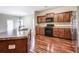 A kitchen featuring stainless steel appliances, a large island, and wood flooring at 6470 Saint Mark Way, Fairburn, GA 30213