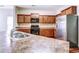 Modern kitchen featuring stainless steel appliances, granite countertops, and ample cabinet space at 6470 Saint Mark Way, Fairburn, GA 30213