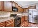 Updated kitchen with modern appliances, ample counter space, and stylish cabinetry, ideal for cooking and entertaining at 6470 Saint Mark Way, Fairburn, GA 30213