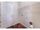 A laundry room with washer and dryer hookups and a wire shelf at 6470 Saint Mark Way, Fairburn, GA 30213
