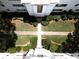 Aerial view of a landscaped building with a manicured courtyard featuring symmetrical pathways and lush greenery at 1120 Briarcliff Ne Rd # 5, Atlanta, GA 30306
