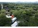 Drone shot showcases property nestled in lush greenery near amenities with skyline view at 1120 Briarcliff Ne Rd # 5, Atlanta, GA 30306