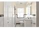 Classic bathroom features a white sink, toilet, and tiled shower, complemented by black trim accents and neutral wall color at 1120 Briarcliff Ne Rd # 5, Atlanta, GA 30306