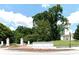 Stone Emory University entrance with manicured landscaping, stately pillars, and a view of historic campus buildings at 1120 Briarcliff Ne Rd # 5, Atlanta, GA 30306