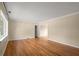 Spacious living room with hardwood floors, neutral paint, and large windows offering plenty of natural light at 1120 Briarcliff Ne Rd # 5, Atlanta, GA 30306