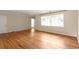 A spacious living room offers hardwood floors, neutral paint, a large window, and traditional trim at 1120 Briarcliff Ne Rd # 5, Atlanta, GA 30306