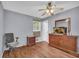 Spacious bedroom boasts a ceiling fan, TV on a dresser, and laminate flooring at 2199 Clairmont Cir, Snellville, GA 30078