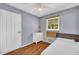 Charming bedroom with a ceiling fan, dresser, and natural light from the window at 2199 Clairmont Cir, Snellville, GA 30078