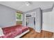 Comfortable bedroom featuring wood-look floors, a ceiling fan, and closet space at 2199 Clairmont Cir, Snellville, GA 30078