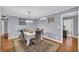 The dining room has neutral paint, hardwood floors, and decor at 2199 Clairmont Cir, Snellville, GA 30078