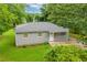 Charming single-story home with a well-maintained lawn and mature trees at 2199 Clairmont Cir, Snellville, GA 30078
