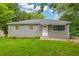 A lovely one-story home with green grass and a front yard at 2199 Clairmont Cir, Snellville, GA 30078
