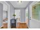 Hallway featuring hardwood floors, and access to other rooms in the house at 2199 Clairmont Cir, Snellville, GA 30078