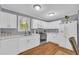 Well-lit kitchen featuring white cabinets, modern appliances, and countertops at 2199 Clairmont Cir, Snellville, GA 30078
