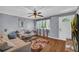 Inviting living room with hardwood floors, neutral paint, comfortable couches, and stylish decorations at 2199 Clairmont Cir, Snellville, GA 30078