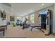 Well-equipped fitness center featuring treadmills, elliptical machines, and weightlifting equipment for residents' use at 3442 Fishpond Cir, Dacula, GA 30019