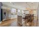 Modern kitchen with stainless steel refrigerator, ample counter space, and stylish pendant lighting fixtures at 3442 Fishpond Cir, Dacula, GA 30019