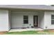 Covered back porch with neutral siding, a window, and a door to backyard at 509 Grace Ln, Villa Rica, GA 30180