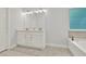 Bright bathroom features double vanity and large mirror at 509 Grace Ln, Villa Rica, GA 30180