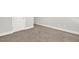 Neutral tone carpeting and a white door are featured in this image at 509 Grace Ln, Villa Rica, GA 30180