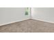 Bedroom featuring neutral carpeting and a window providing natural light at 509 Grace Ln, Villa Rica, GA 30180
