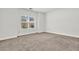 Bedroom featuring neutral carpeting and a window providing natural light at 509 Grace Ln, Villa Rica, GA 30180