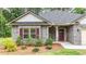 Close-up of the home's entrance, showcasing the brick facade, landscaping, and welcoming front door at 509 Grace Ln, Villa Rica, GA 30180