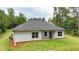 Rear exterior of home with siding, windows, and well-maintained lawn at 509 Grace Ln, Villa Rica, GA 30180