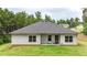 Rear exterior view showcasing siding, roof, and yard at 509 Grace Ln, Villa Rica, GA 30180