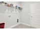 Laundry room featuring storage shelves and connections for washer and dryer at 509 Grace Ln, Villa Rica, GA 30180