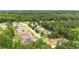 Aerial view of neighborhood, showcasing the home nestled amongst mature trees and lush greenery at 509 Grace Ln, Villa Rica, GA 30180