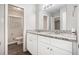 Bright bathroom with double vanity, granite countertops, and modern fixtures at 637 Carlouetta Sw Rd, Mableton, GA 30126